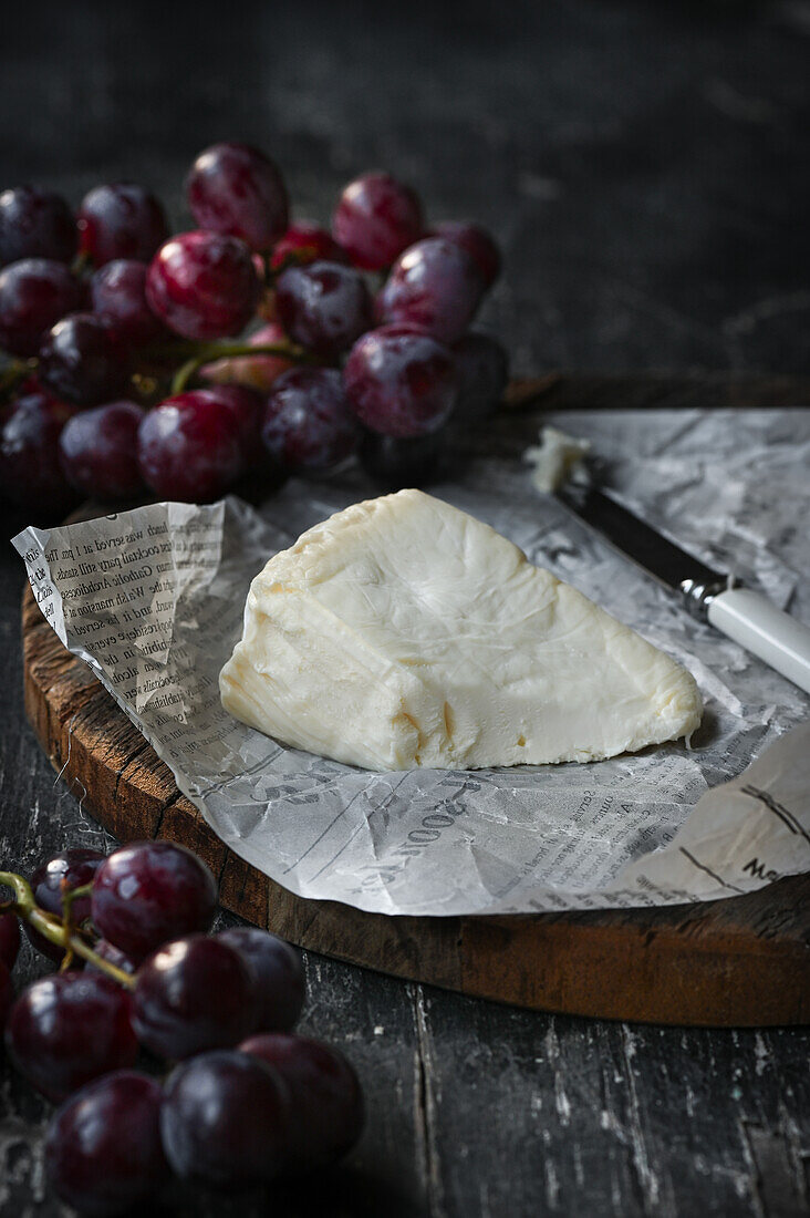 Soft cheese with blue grapes