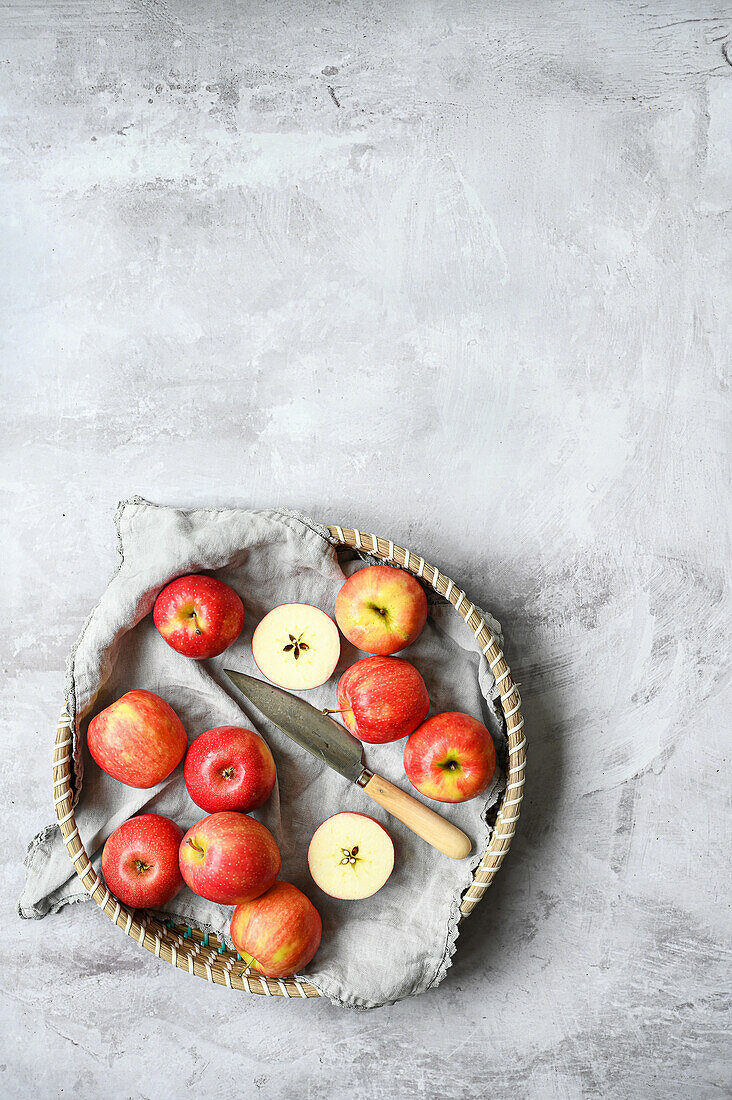 Red apples and slices in a basket