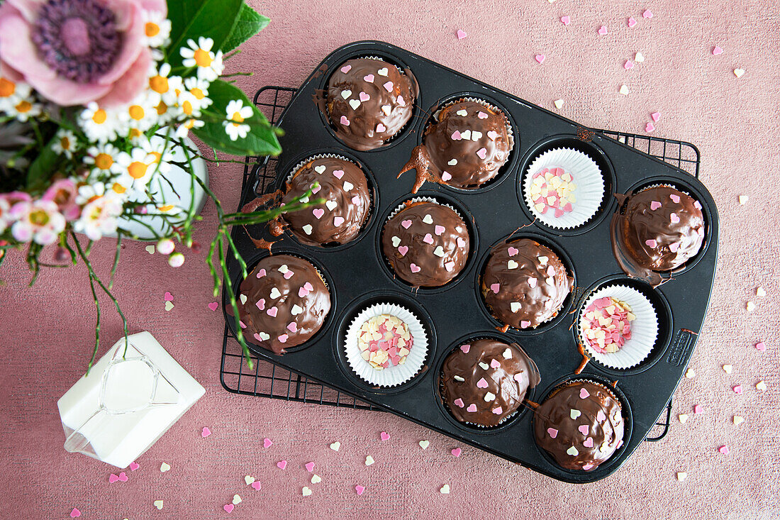 Chocolate muffins with little sugar hearts