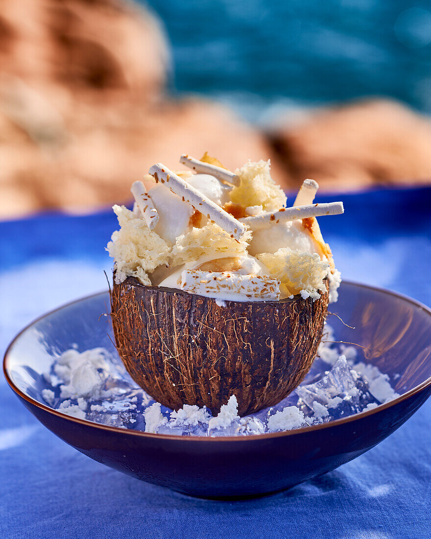 Coconut dessert in a coconut half