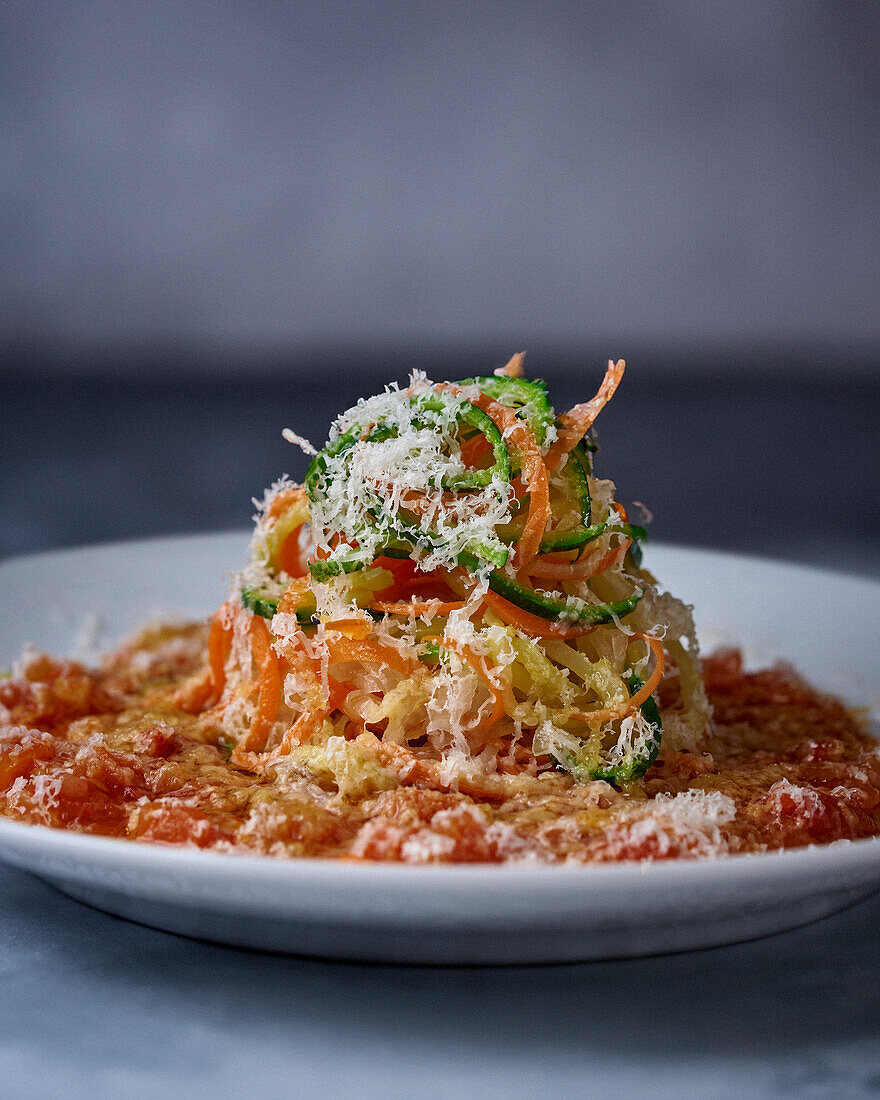 Vegetable spaghetti with grated cheese