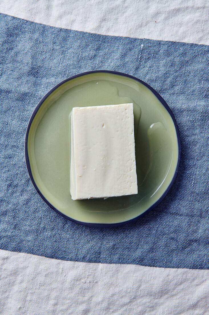 A block of tofu on a plate