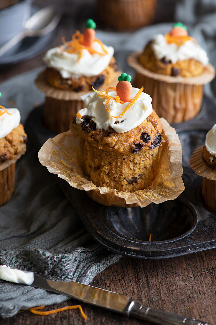 Carrot cake muffins with cream cheese icing
