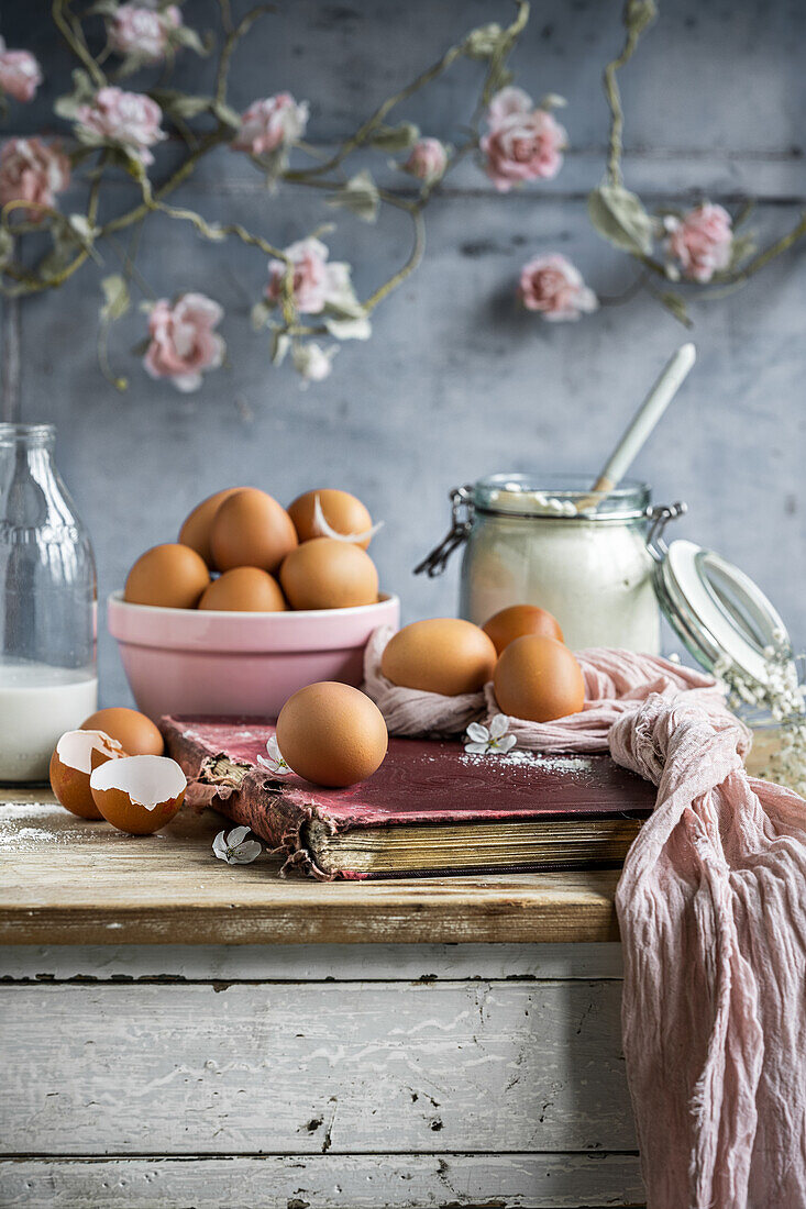 Baking ingredients and old cookery book