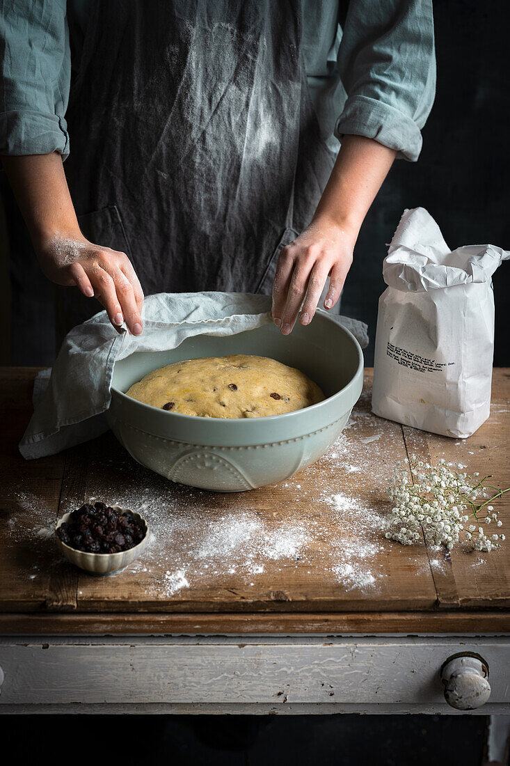 Woman testing hot cross bun dough