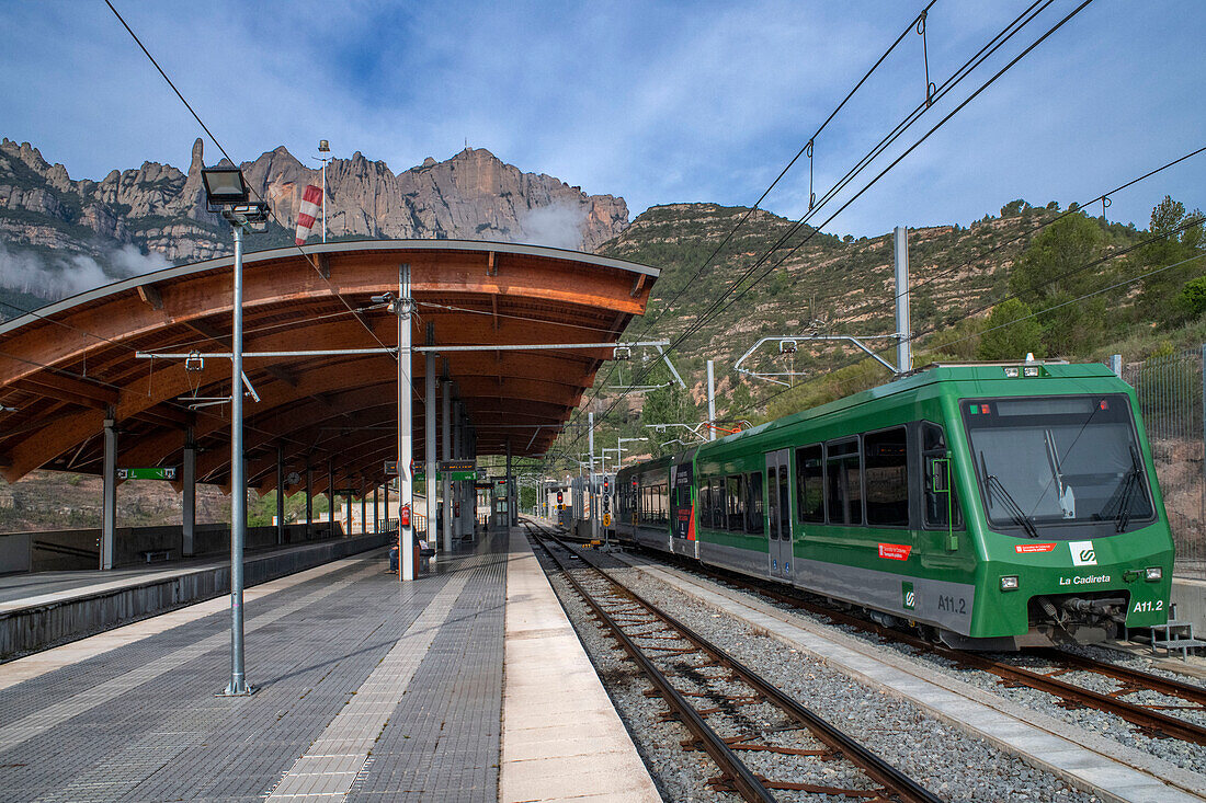 Monistrol Central train station and Cremallera de Montserrat rack railway train. Monistrol de Montserrat, Spain