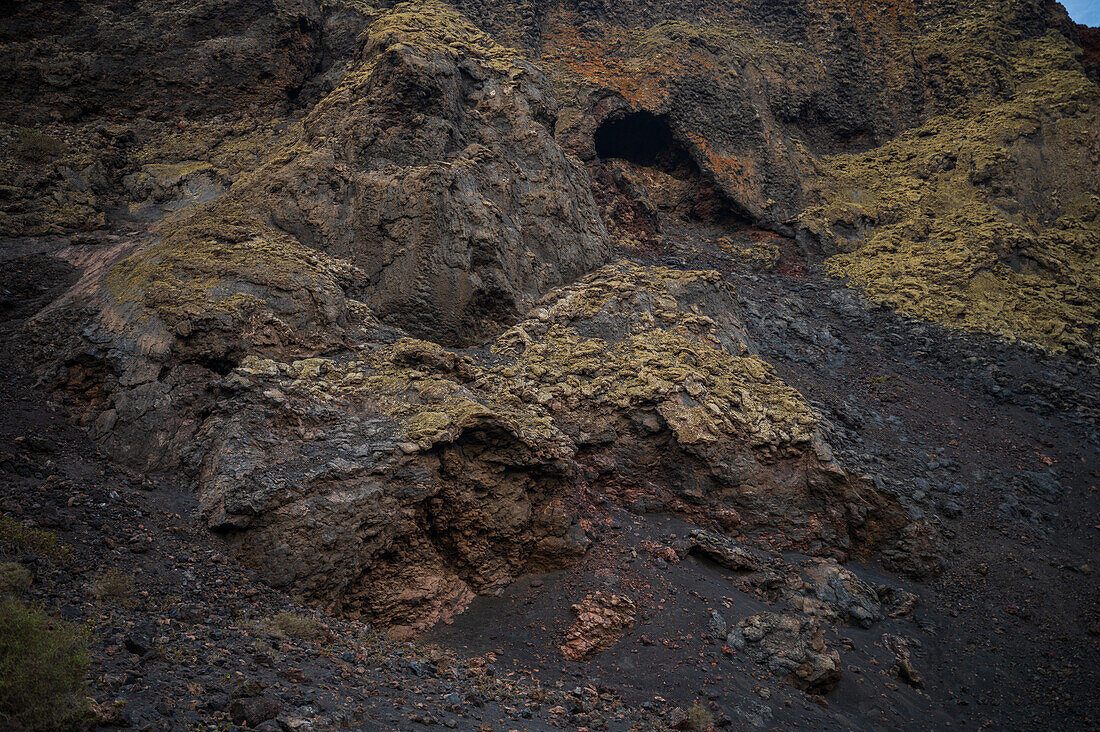 Volcan del Cuervo (Crow volcano) a crater explored by a loop trail in a barren, rock-strewn landscape