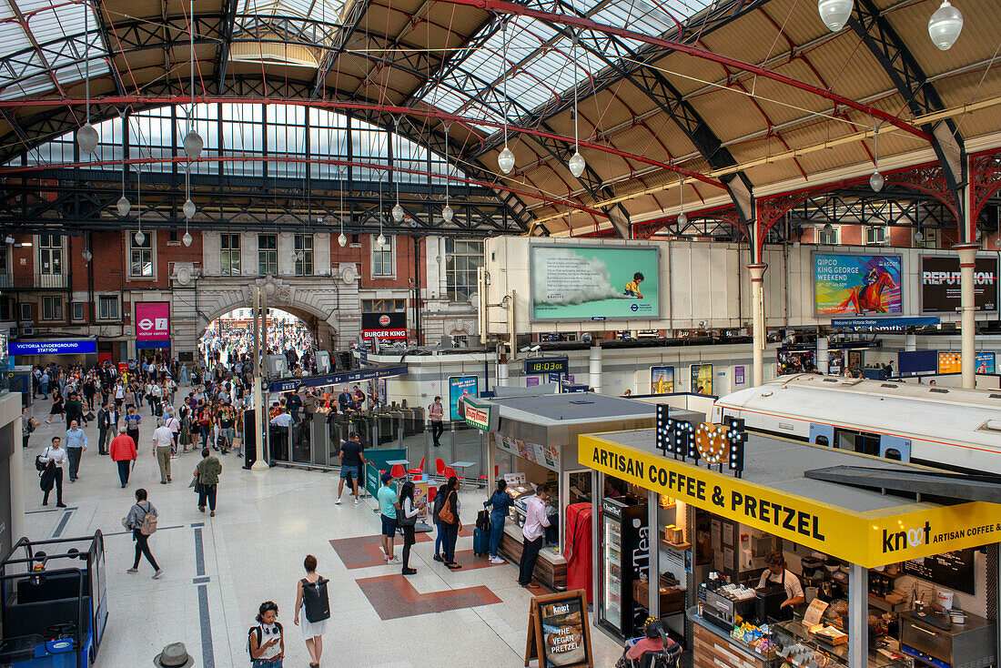 British rail London Victoria train station platform with travelers London England.