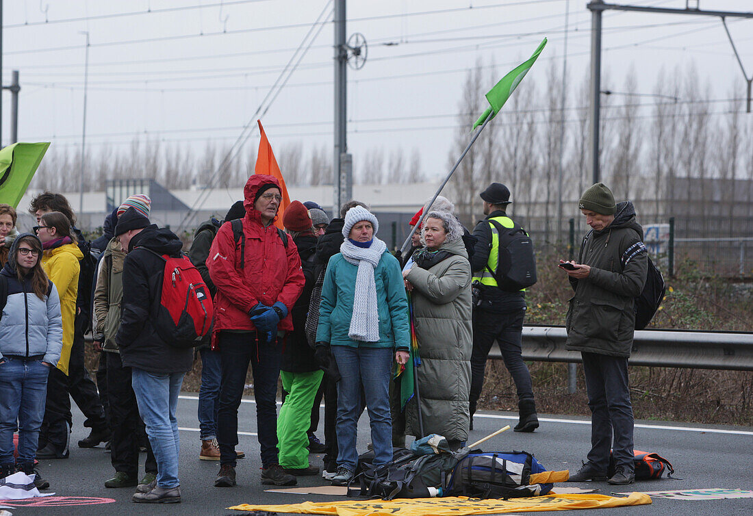 Extinction Rebellion climate activists gather to block the main highway A10 in front of the former headquarters of Dutch multinational bank on December 30, 2023 in Amsterdam,Netherlands. Environmental protectors of Extinction Rebellion make a demonstration against ING bank to protest its financing of fossil fuels.