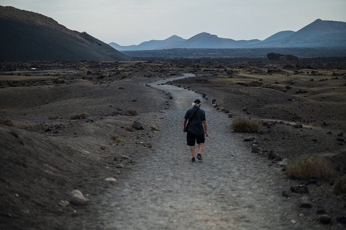 Volcan del Cuervo (Crow volcano) a crater explored by a loop trail in a barren, rock-strewn landscape