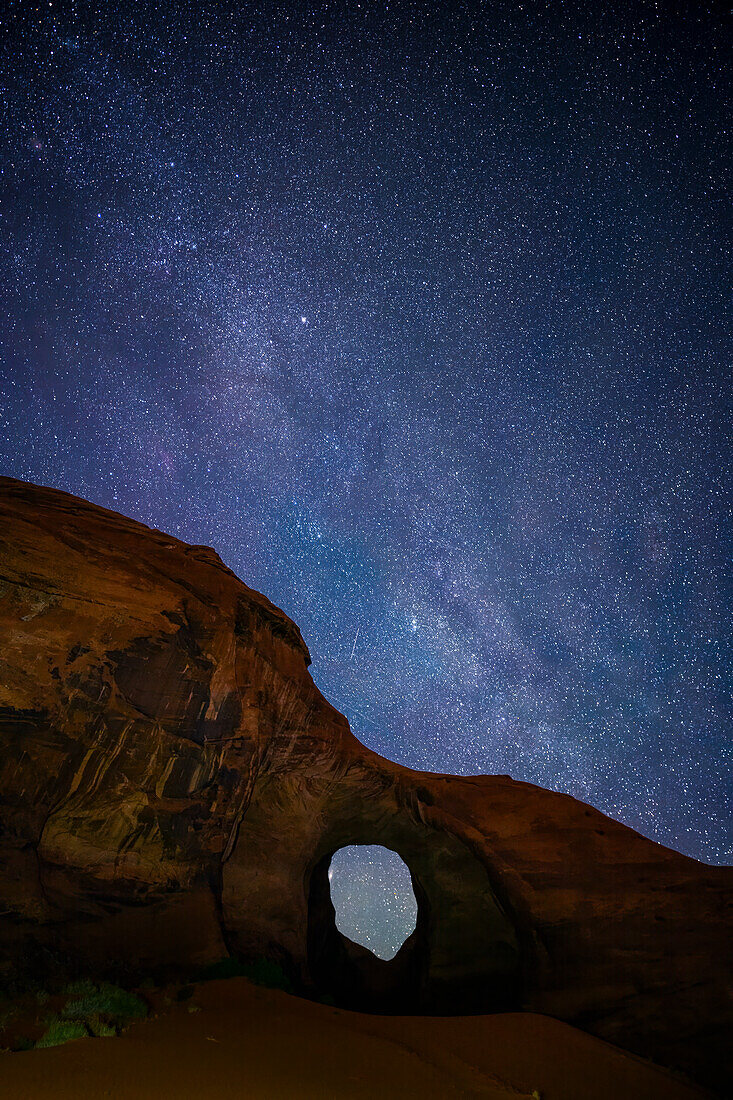 Milky Way over arch in Monument Valley Navajo Tribal Park, Arizona.