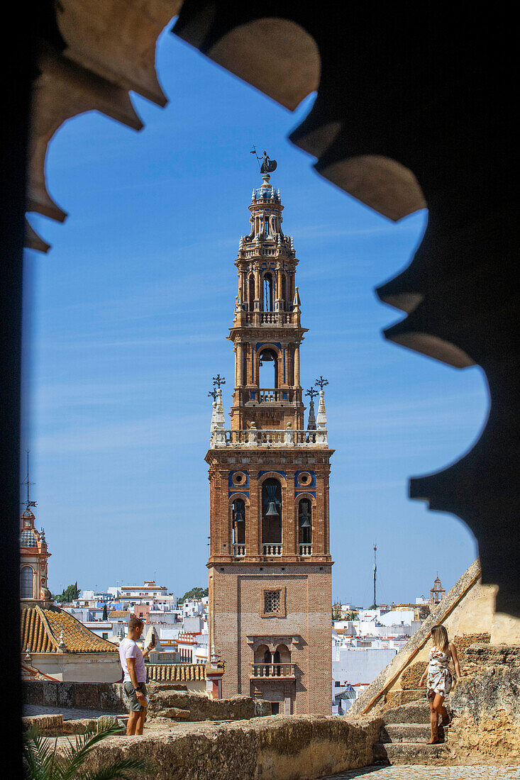 Alcázar puerta de Sevilla (Seville Gate) with San Pedro church in the background, Carmona, Andalusia, Spain. Old town Carmona Seville Andalusia South of Spain.