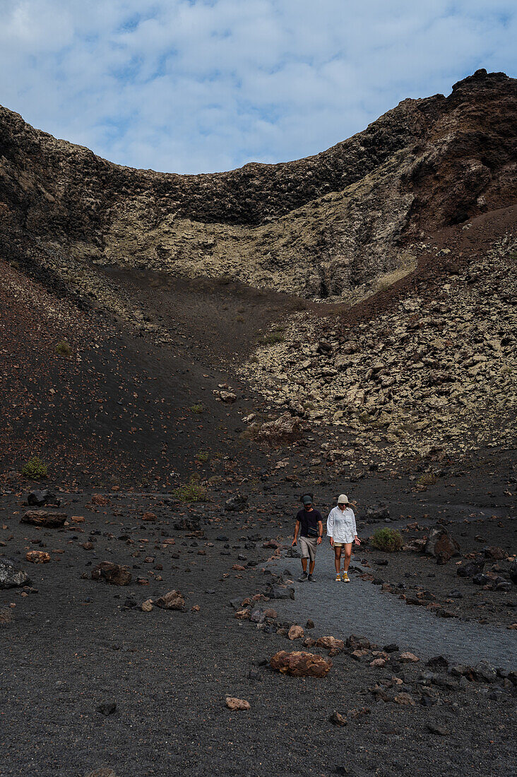 Volcan del Cuervo (Crow volcano) a crater explored by a loop trail in a barren, rock-strewn landscape