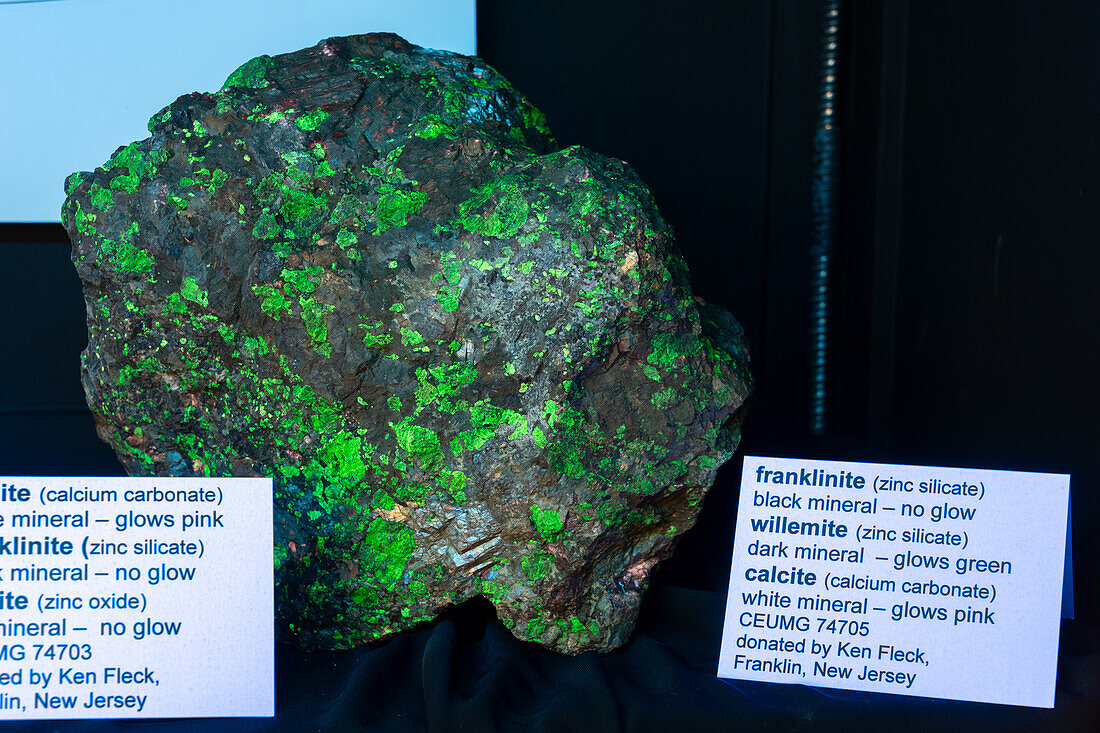 Franklinite, Willemite & Calcite minerals fluorescing under ultraviolet light. USU Eastern Prehistoric Museum, Price, Utah.