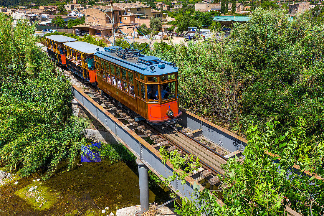 Vintage tram next to the Soller village. The tram operates a 5kms service from the railway station in the Soller village to the Puerto de Soller, Soller Majorca, Balearic Islands, Spain, Mediterranean, Europe.