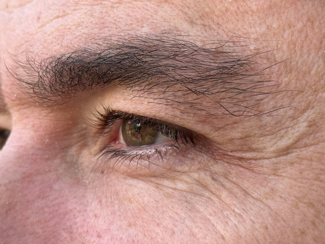 Close up photo of the eye of a 47 year old man