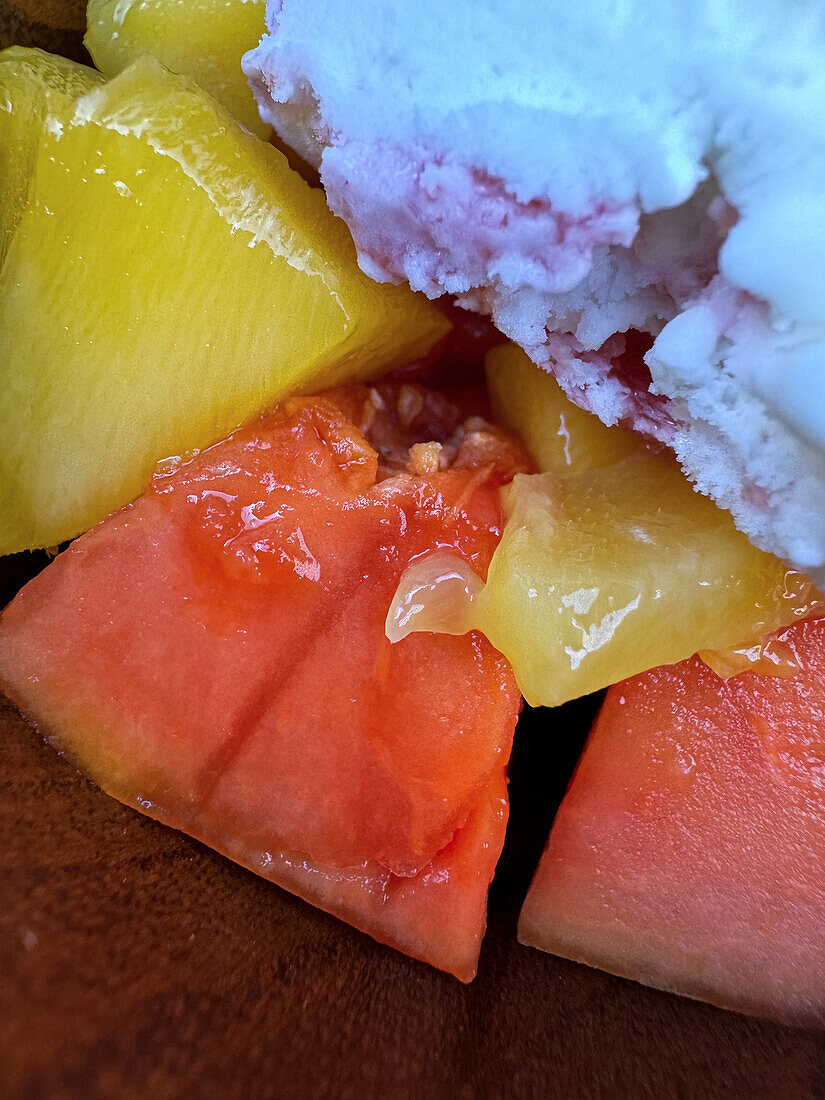 Close up at ice cream dessert with fruit