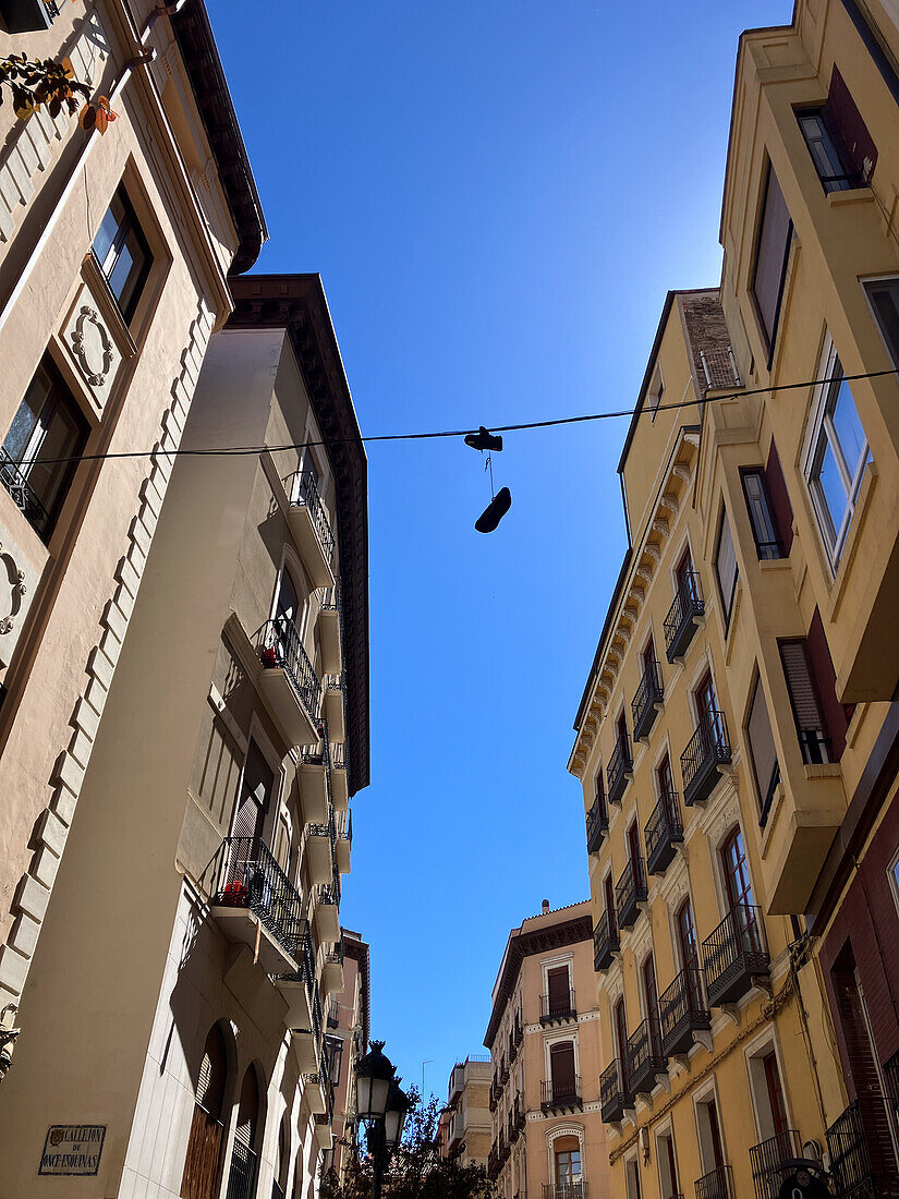 Shoes hanging from a power line