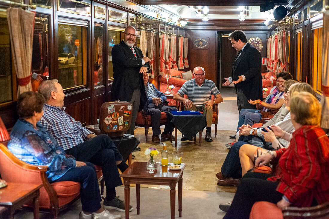 Magic tricks show inside Al-Andalus luxury train travelling around Andalusia Spain.