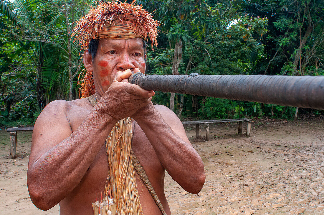 Hunting blow dart, Yagua Indians living a traditional life near the Amazonian city of Iquitos, Peru.