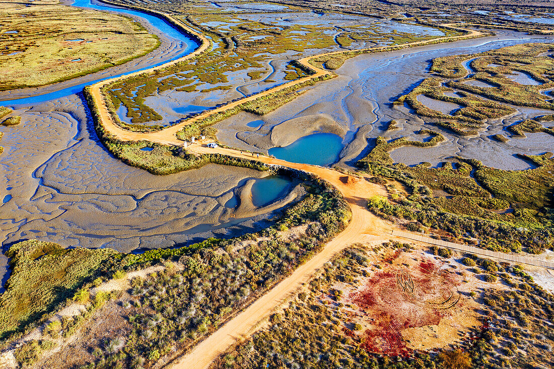 Aerial view of Salinas del Duque saltworks walking road marshes Isla Cristina, Huelva Province, Andalusia, southern Spain.