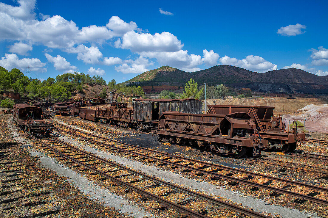 Old abandoned steam trains seen from the touristic train used for tourist trip through the RioTinto mining area, Huelva province, Spain.