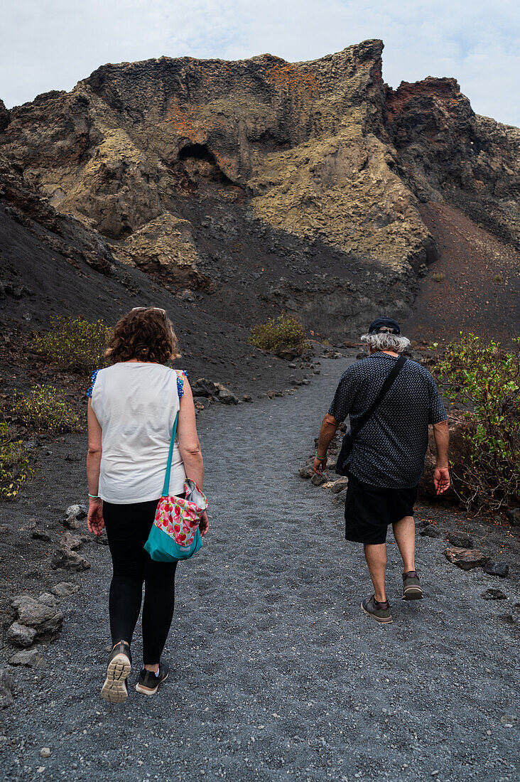 Volcan del Cuervo (Crow volcano) a crater explored by a loop trail in a barren, rock-strewn landscape