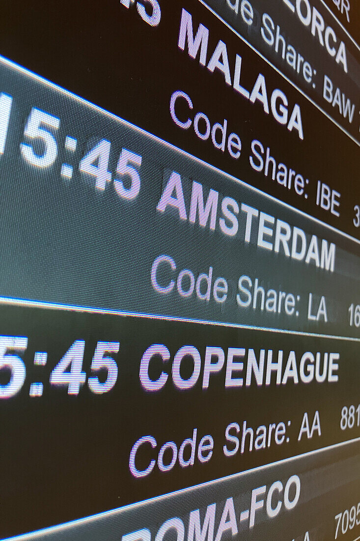 Departure information boards in Madrid Airport, Spain