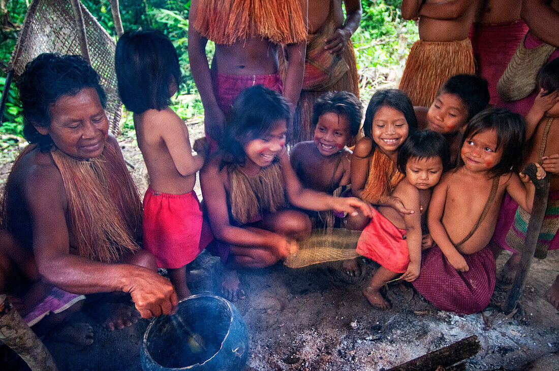 Cooking Yagua Indians living a traditional life near the Amazonian city of Iquitos, Peru.