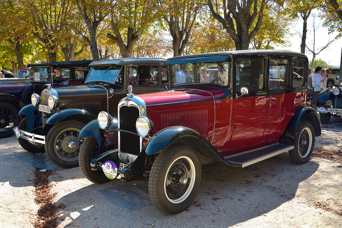 A Citroën and a Ford classic cars in a car festival in San Lorenzo de El Escorial, Madrid.