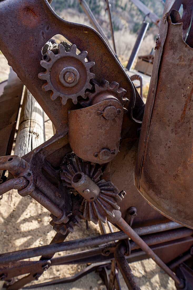 Mechanical detail of a vintage Deering New Ideal grain binding machine at Cottonwood Glen in Nine Mile Canyon, Utah.