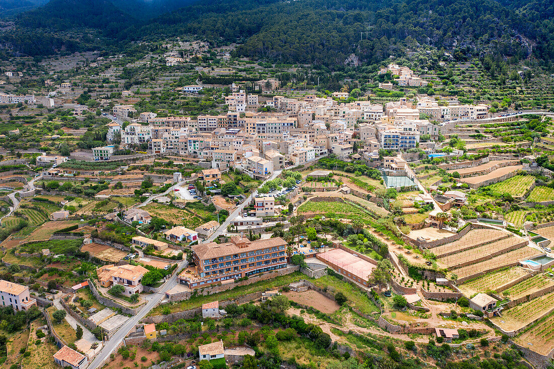 Aerial view of Majorca west coast Mallorca, Banyalbufar, mountain village and terrace fields, Serra de Tramuntana, Mallorca, Balearic Islands, Spain.