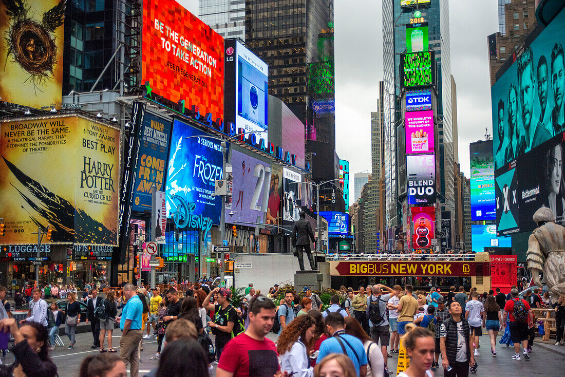 Times Square, New York City at night. Crowds in Times Square on a fall evening, Midtown Manhattan, NY, USA