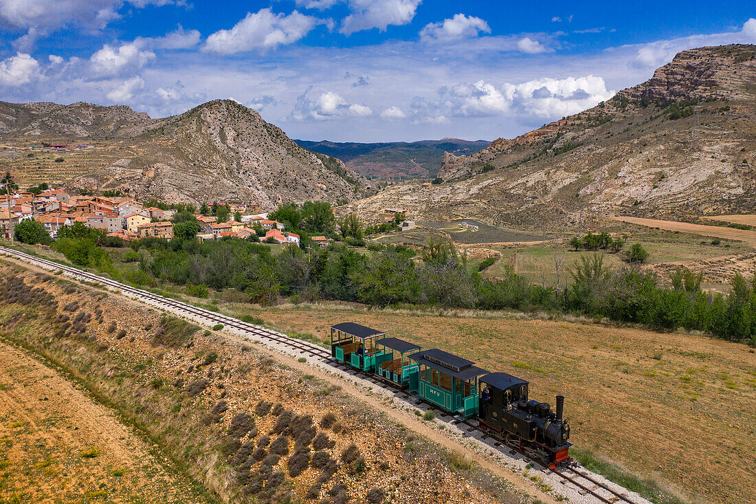 Aerial view of steam train, Utrillas mining train and Utrillas Mining and Railway Theme Park, Utrillas, Cuencas Mineras, Teruel, Aragon, Spain.