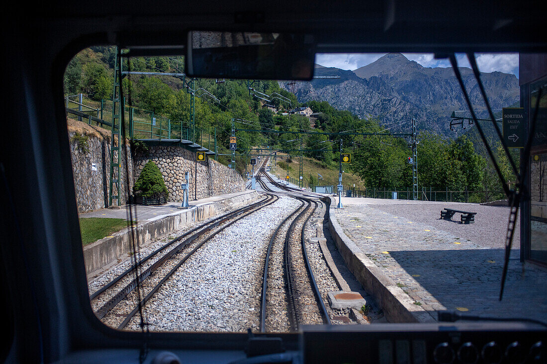 Views from the window. Cogwheel railway Cremallera de Núria train in the Vall de Núria valley, Pyrenees, northern Catalonia, Spain, Europe.