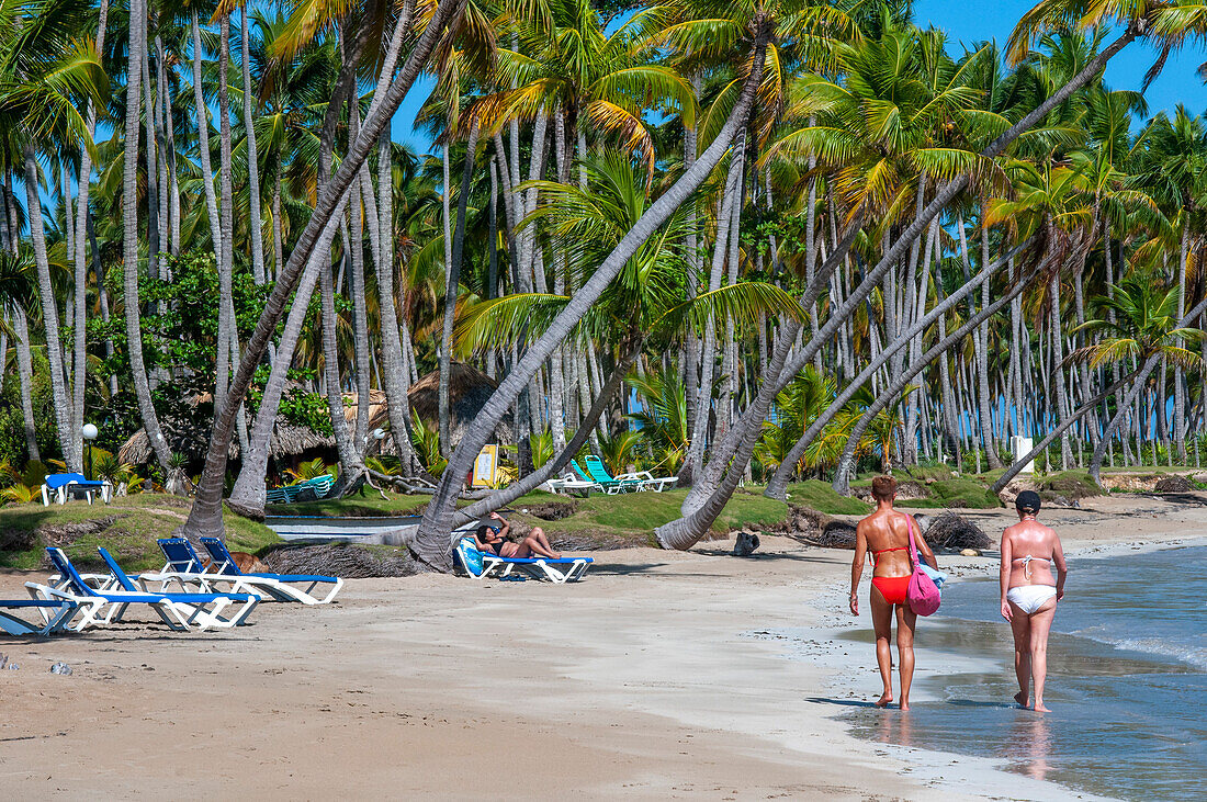 Tourists girls in playa bonita beach on the Samana peninsula in Dominican Republic near the Las Terrenas town.