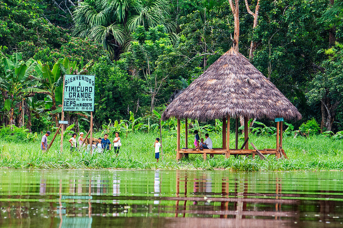 Welcome sign at the Timicuro village on the Amazon River, a tributary of the Amazon, Peru, South America