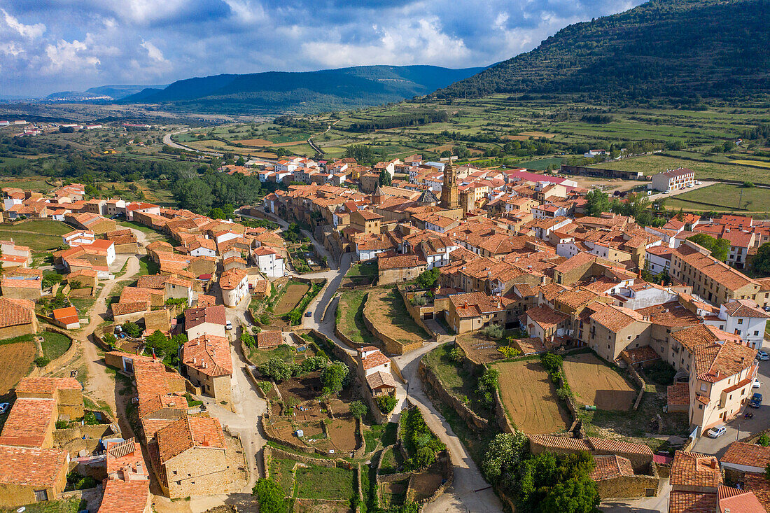 Aerial view of Bell tower of the Church of the Purification and Nublos Tower, La Iglesuela del Cid, Teruel, Aragon, Spain