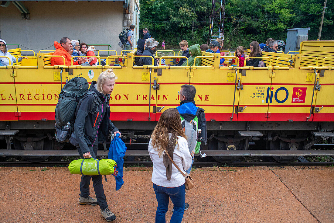 Passengers in Mont Louis La cabanasse train station. The Yellow Train or Train Jaune, Pyrénées-Orientales, Languedoc-Roussillon, France.