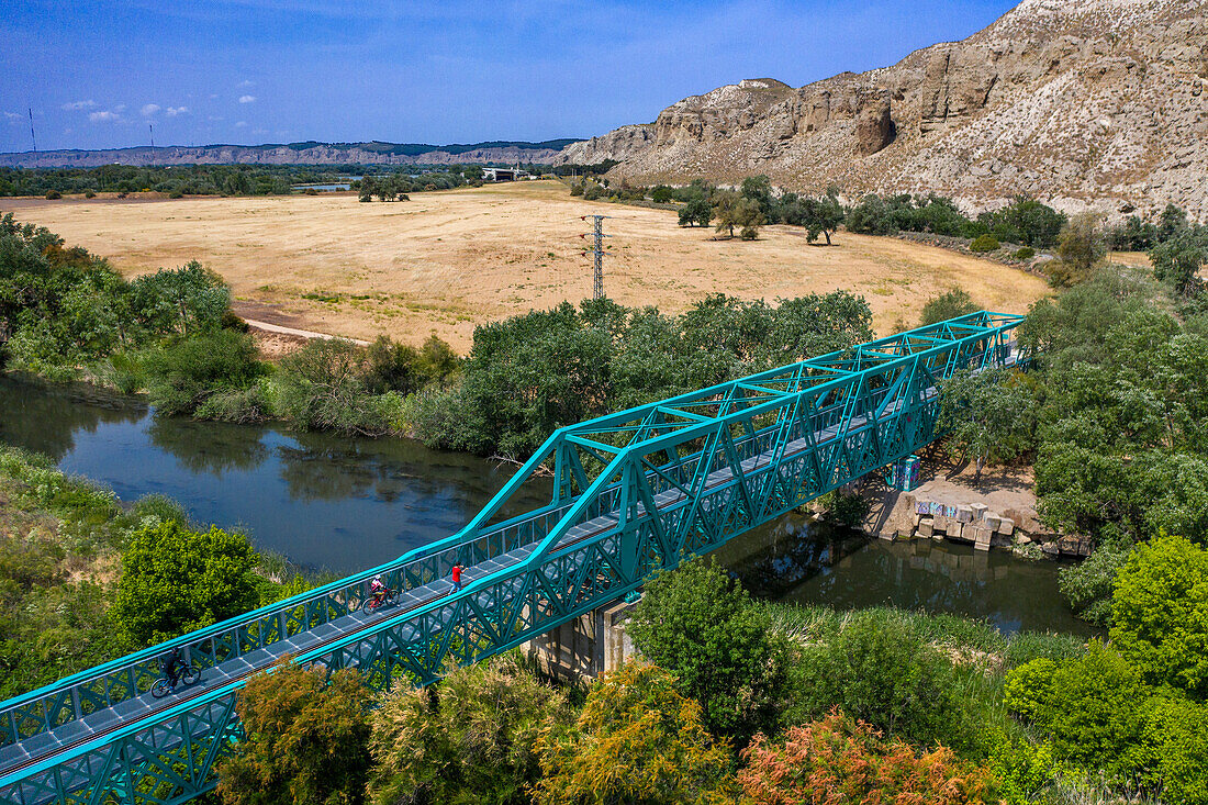 Aerial view, green bridge, puente verde, Jarama river, El Tren de Arganda train or Tren de la Poveda train in Rivas Vaciamadrid, Madrid, Spain.