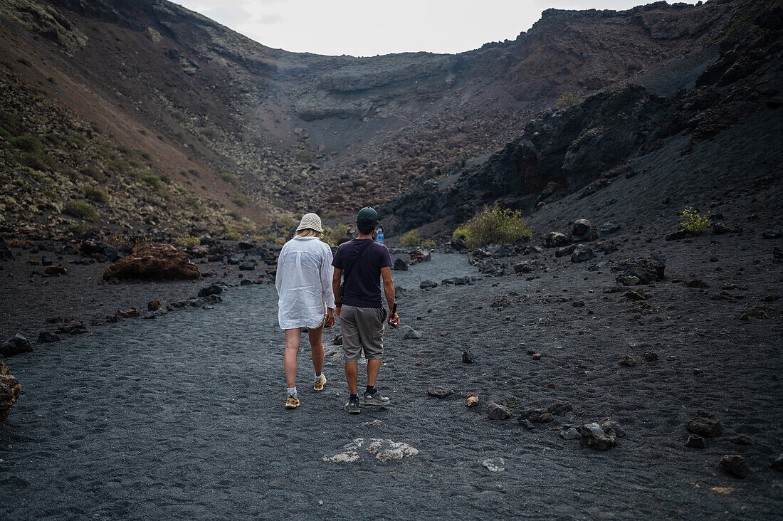 Volcan del Cuervo (Crow volcano) a crater explored by a loop trail in a barren, rock-strewn landscape