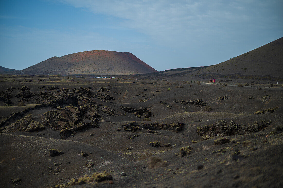 Volcan del Cuervo (Crow volcano) a crater explored by a loop trail in a barren, rock-strewn landscape