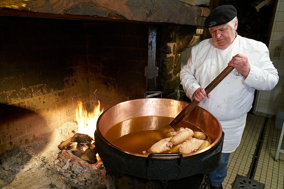 France, Aveyron, Monteils, The Farm of Carles, Jacques Carles, cooking over a wood fire in copper cauldrons, neck of duck stuffed with foie gras