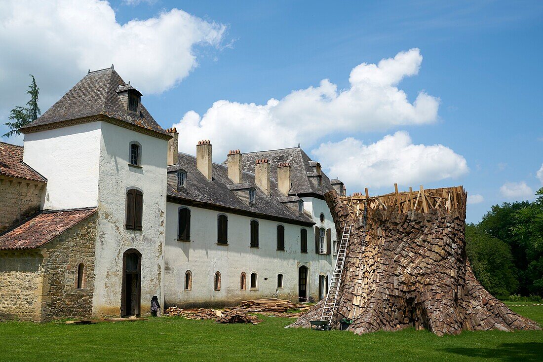 France, Hautes Pyrenees, Abbey of Escaladieu, wooden sculpture under construction in front of Escaladieu Abbey