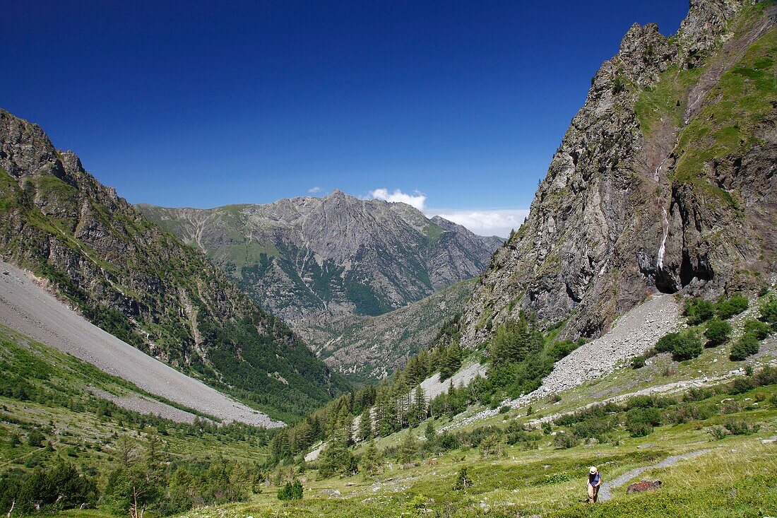 France, Isere, Lavaldens, Female hiker on the path toward Rif bruyant lake