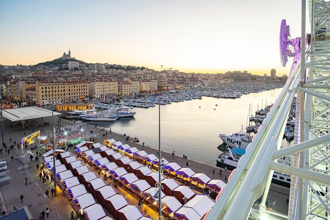 France, Bouches du Rhone, Marseille, the Old Port, the Notre Dame de la Garde basilica and the Christmas market from the Ferris Wheel (aerial view)