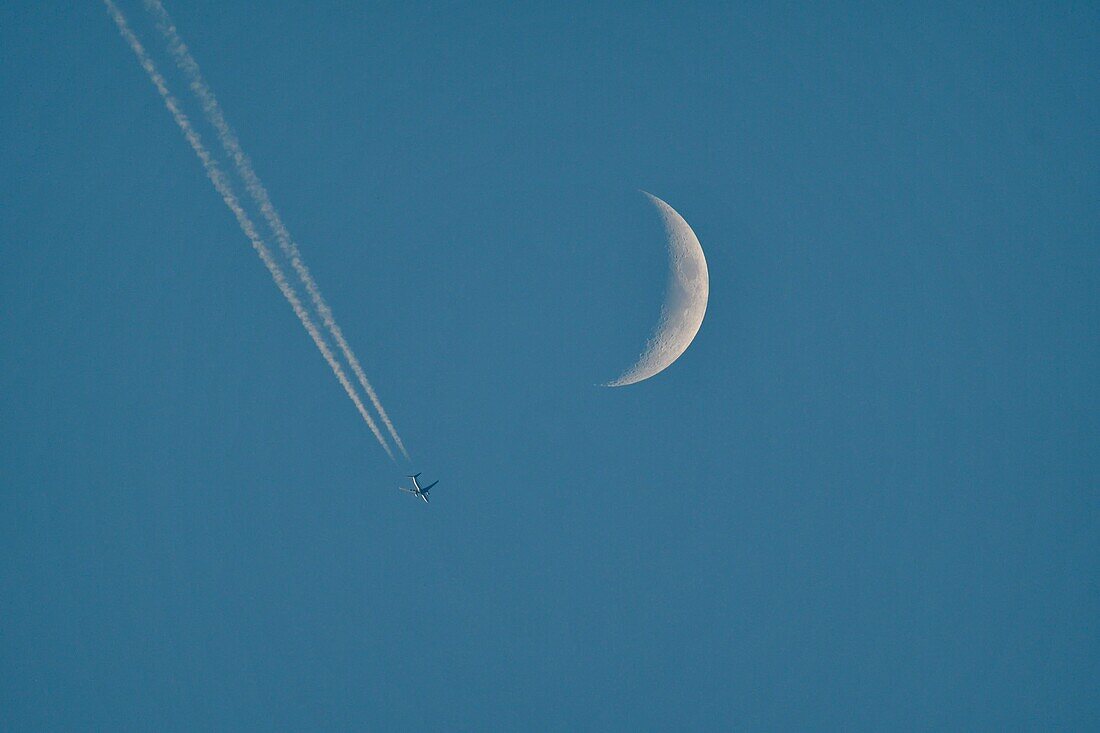 France, Doubs, long haul plane and crescent moon