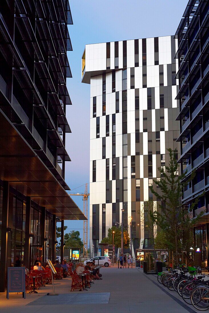 France, Bas Rhin, Strasbourg, development of port du Rhin (Rhine's harbour) and conversion of breakwater of Bassin d'Austerlitz, Black Swans tower of architect Anne Demians and in the background the Elithis Danube Tower, 1st positive energy tower by XTU Architects