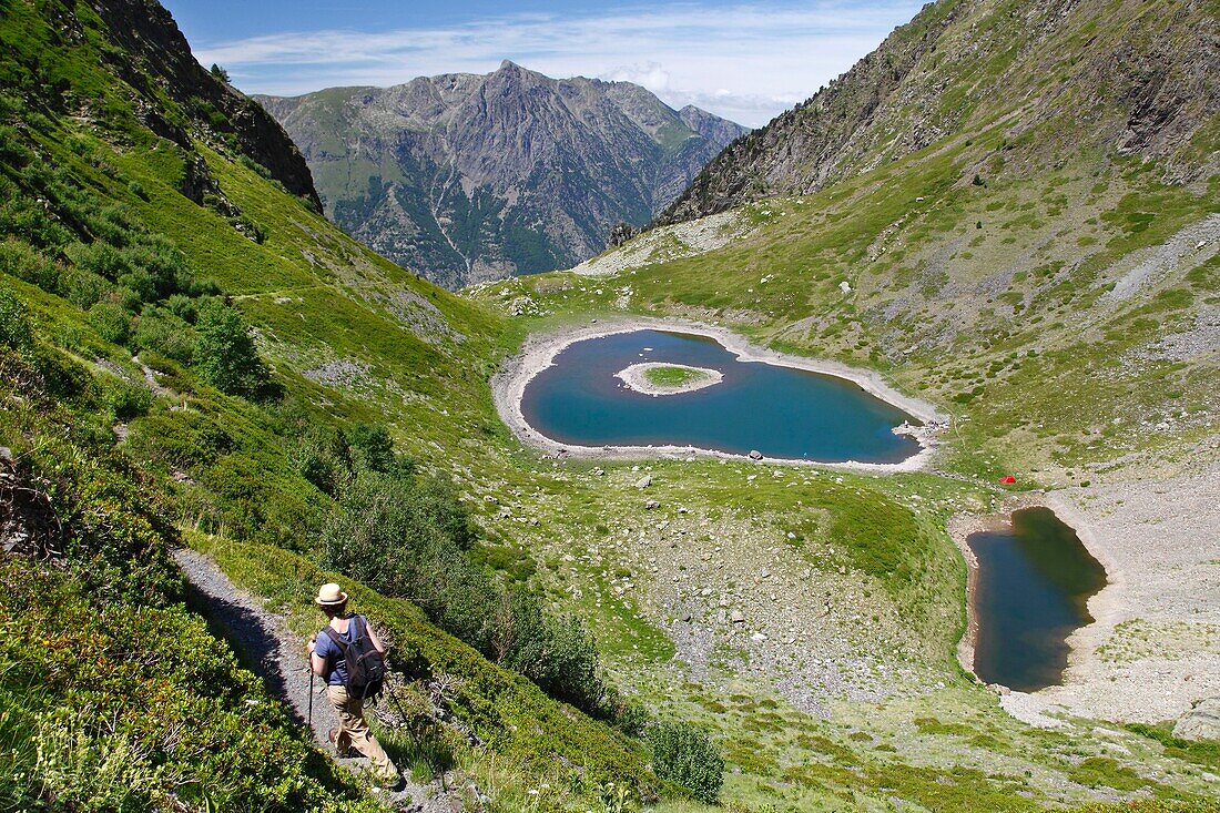 France, Isere, Lavaldens, Female hiker above the Rif bruyant lake