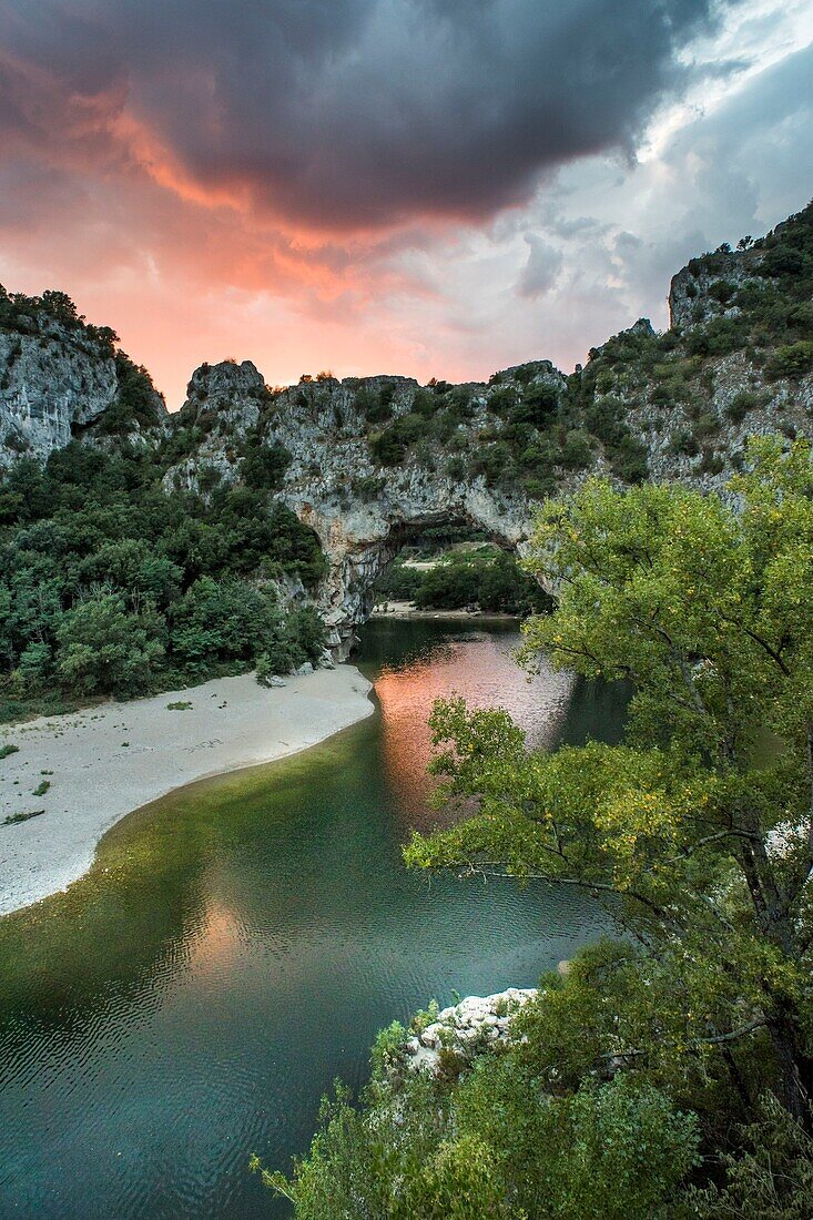 France, Ardeche, the Pont d'Arc arch over Ardeche river at sunset